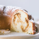 Salted Caramel Bundt Cake with a slice of cake taken out to reveal salted caramel ribboned through out the inside of the cake